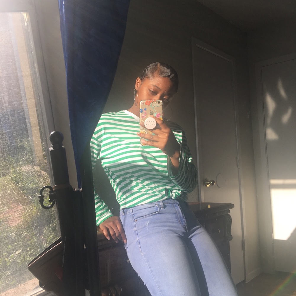 long-sleeved green & white stripped shirt.